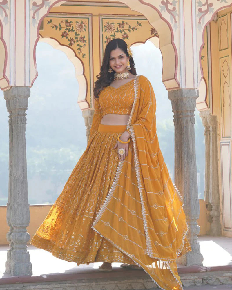 YELLOW COLOR GEORGETTE HEAVY EMBROIDERY THREADED SEMI STITCHED LEHENGA CHOLI