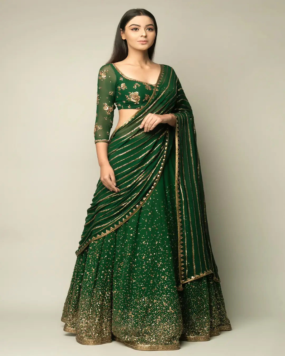 CLASSIC GREEN GEORGETTE BASE STONE AND SEQUENCE WORK LEHENGA CHOLI