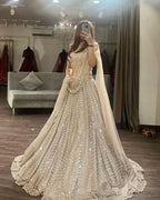 EXUDE ELEGANCE IN EXCLUSIVE WHITE NET LEHENGA CHOLI
